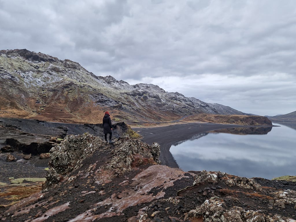 Kleifarvatn lake Woman standing in front of the Kleifarvatn lake