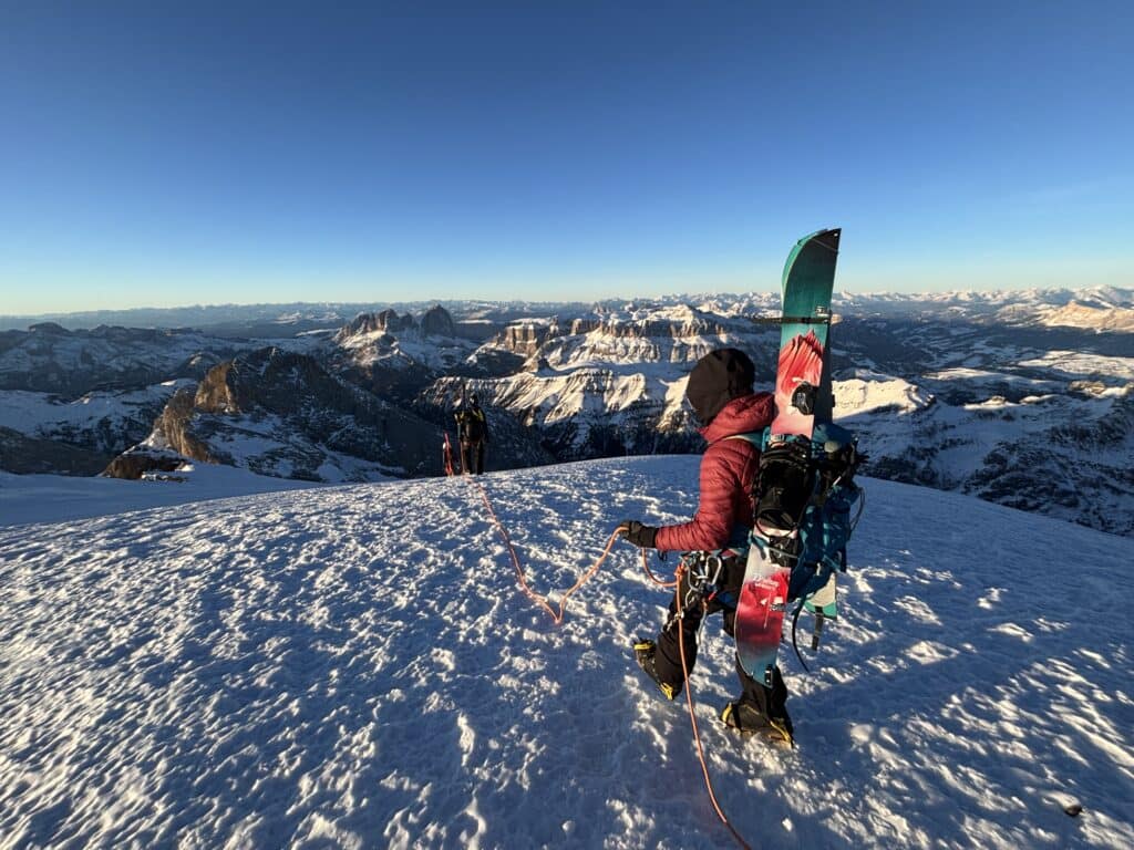 Splitboarding on the summit of Marmolada Punta Penia, Italian Dolomites