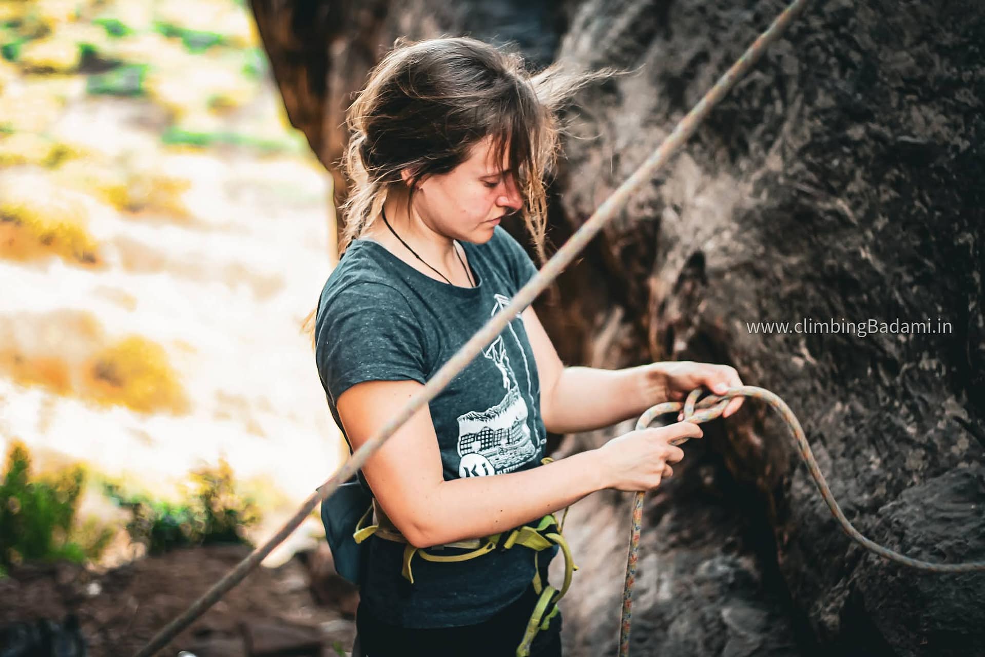 Woman tying an eight knot in Badami, India