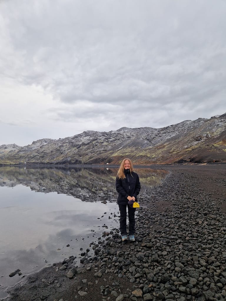 Woman standing in front of the Kleifarvatn lake