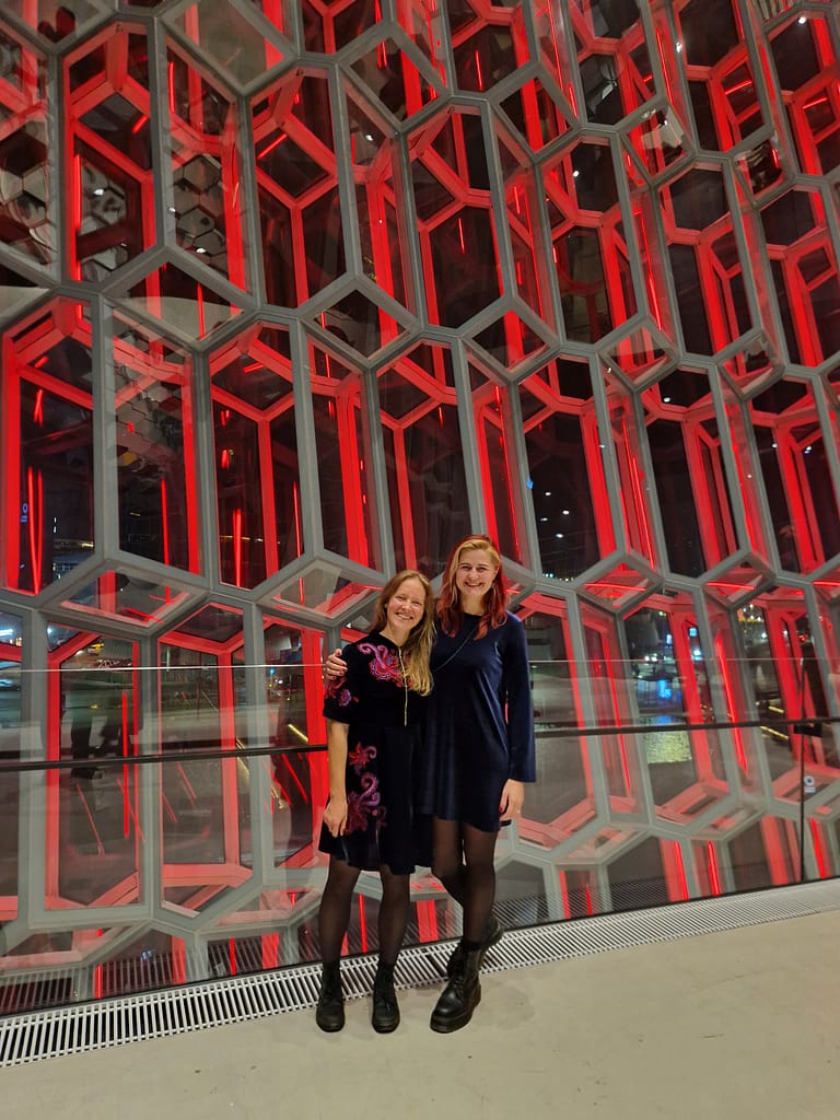 Two happy ladies in Reykjavik Harpa concert hall waiting for Sigur Ros concert
