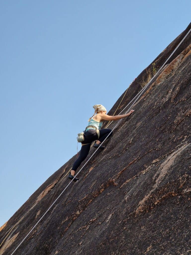 Woman rock climbing in India